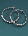 Brilliant X-pattern Round Tubular Hoop Earrings in Sterling Silver