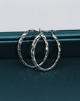 Brilliant X-pattern Round Tubular Hoop Earrings in Sterling Silver