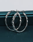 Sterling Silver X-Pattern Diamond-Cut Oval Hoop Earrings, 25 mm