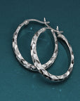 Sterling Silver X-Pattern Diamond-Cut Oval Hoop Earrings, 25 mm