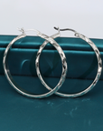 Brilliant X-pattern Round Tubular Hoop Earrings in Sterling Silver